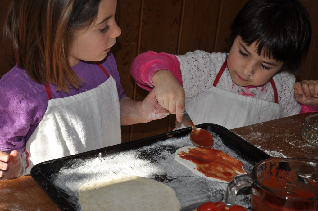 Dressing the pizzas